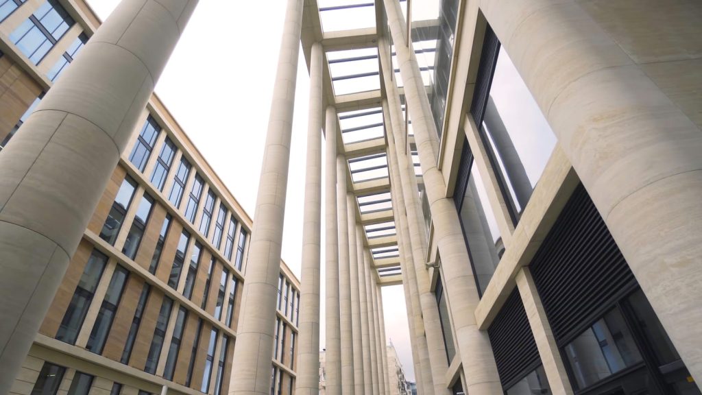 56726904 beautiful colonnade of modern business building action external corridor with rows of columns of business center ancient solutions in architecture of modern buildings